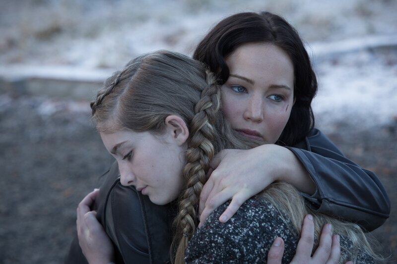 woman hugging a girl