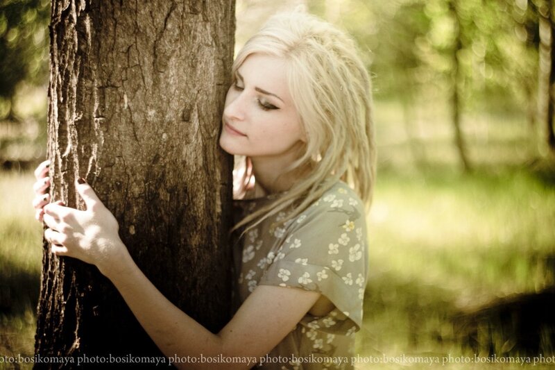 woman hugging a tree