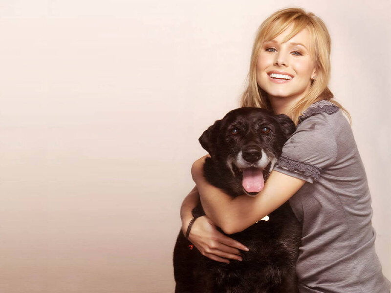 Woman Hugging Black Dog