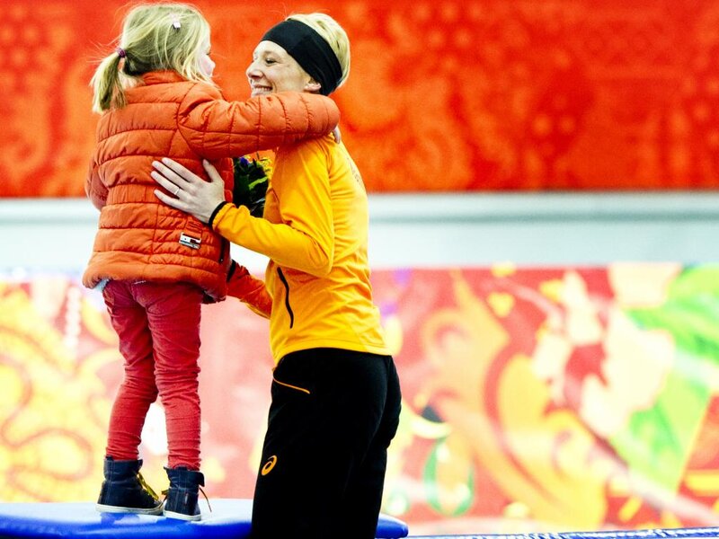 Woman Hugging Child — Orange