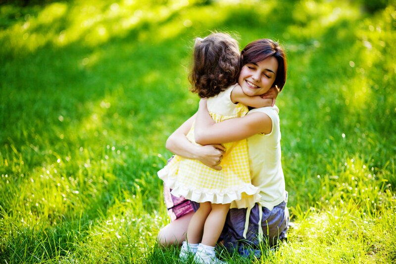 Woman Hugging Child