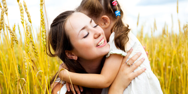 Woman Hugging Child — Yellow, Peaceful