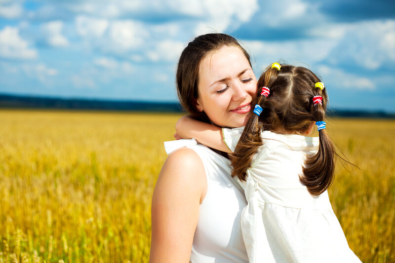 Woman Hugging Child — Yellow