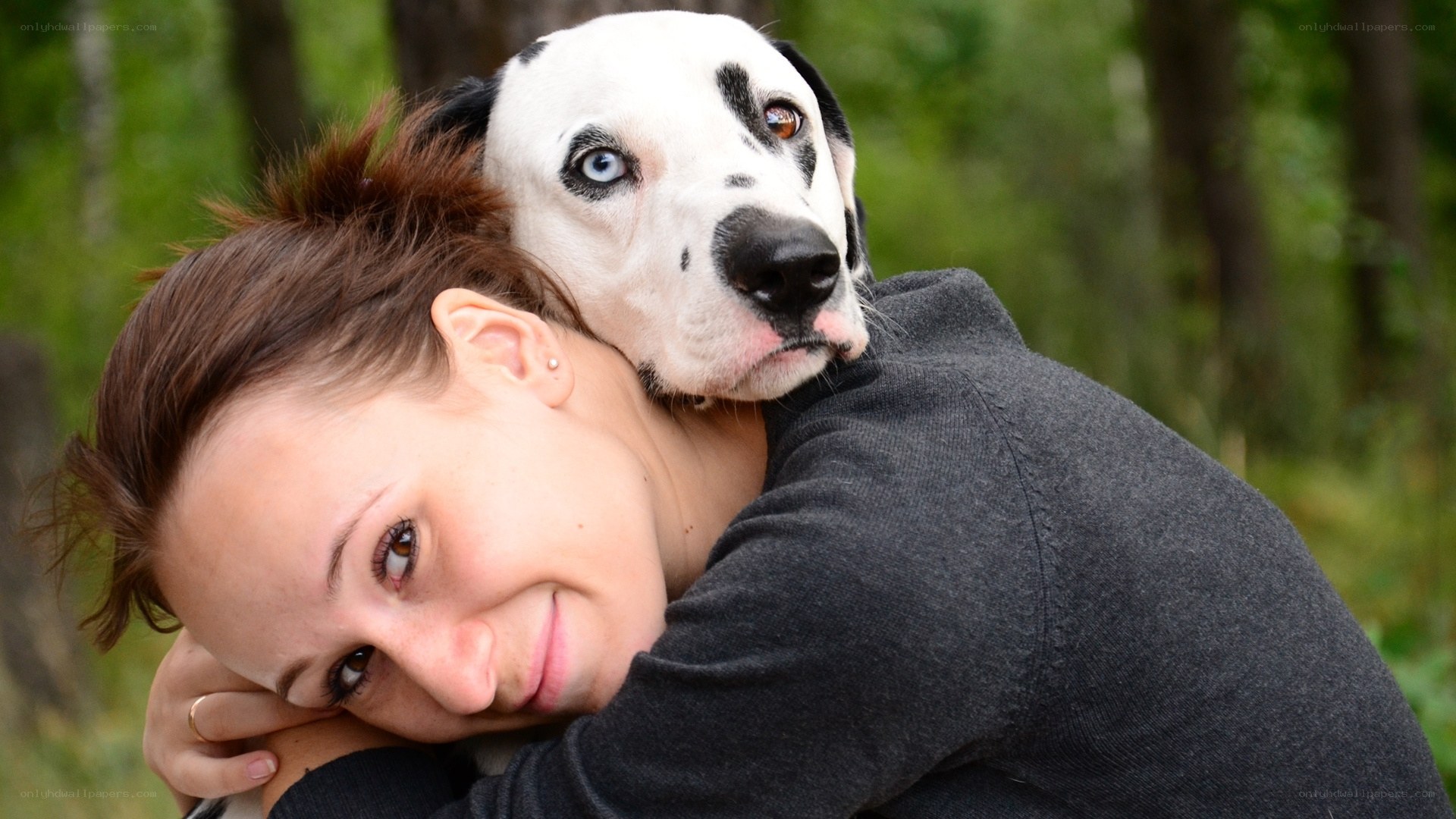 woman hugging dalmatian dog
