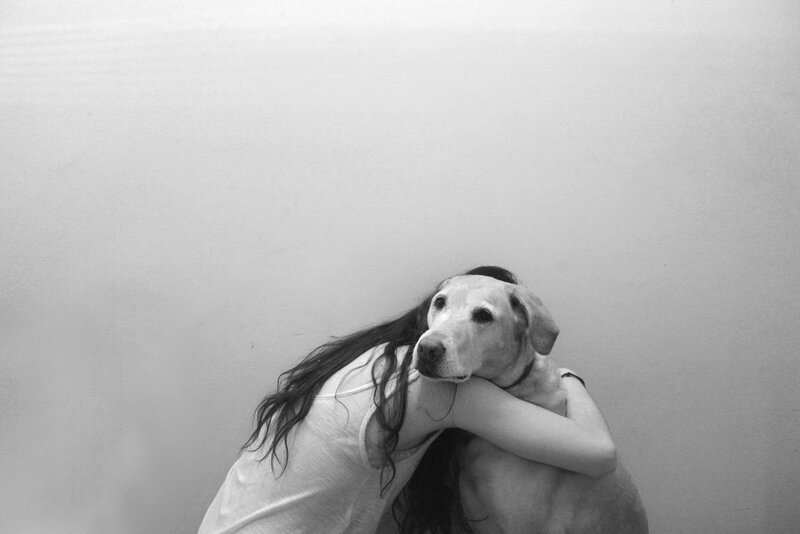 Woman Hugging Dog