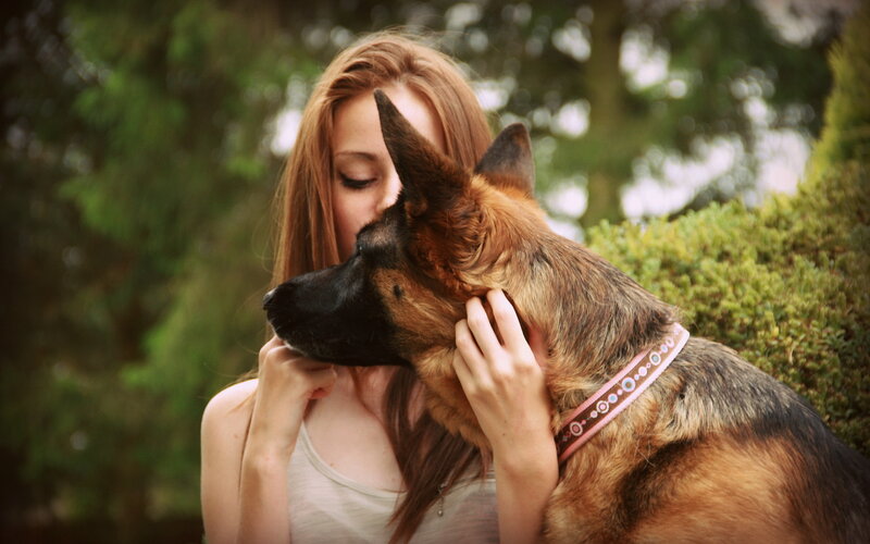 Woman Hugging German Shepherd