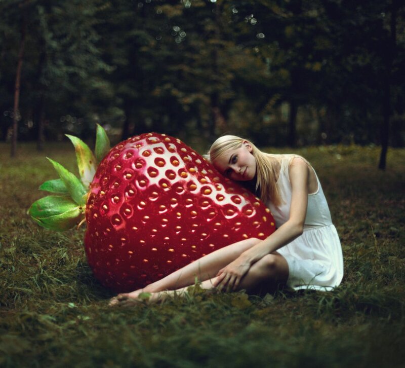 Woman Hugging Giant Strawberry