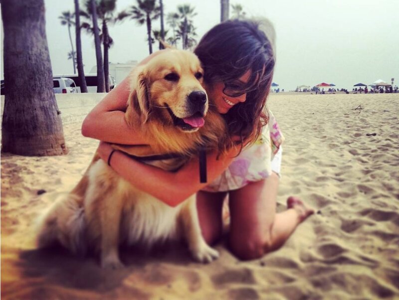 Woman Hugging Golden Retriever