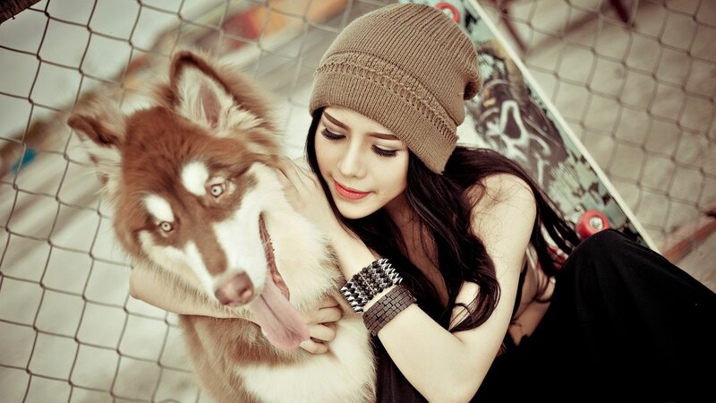 Woman Hugging Husky