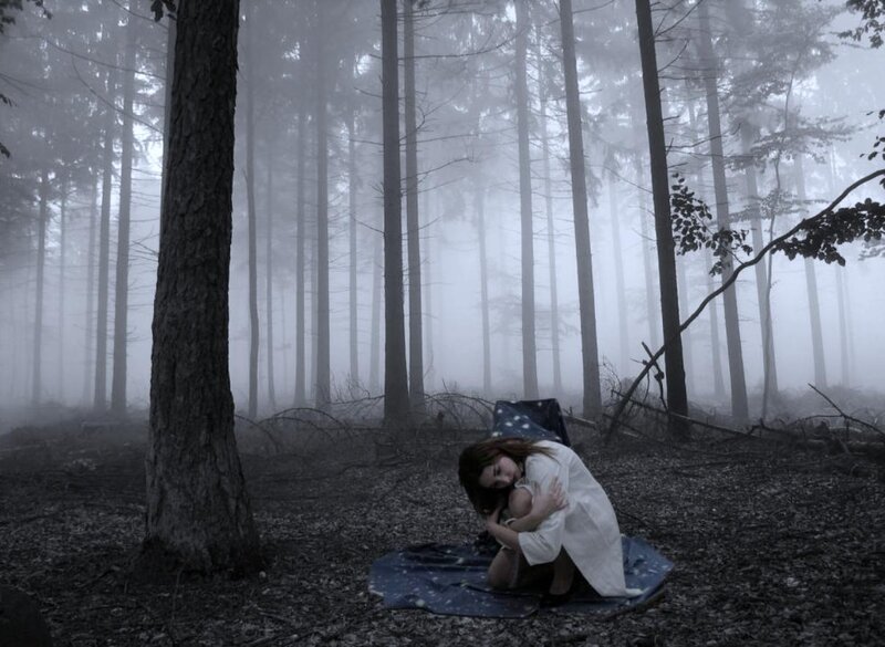 Woman Hugging Knees