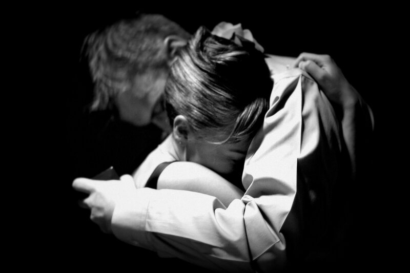 Woman Hugging Man — Black, Dramatic