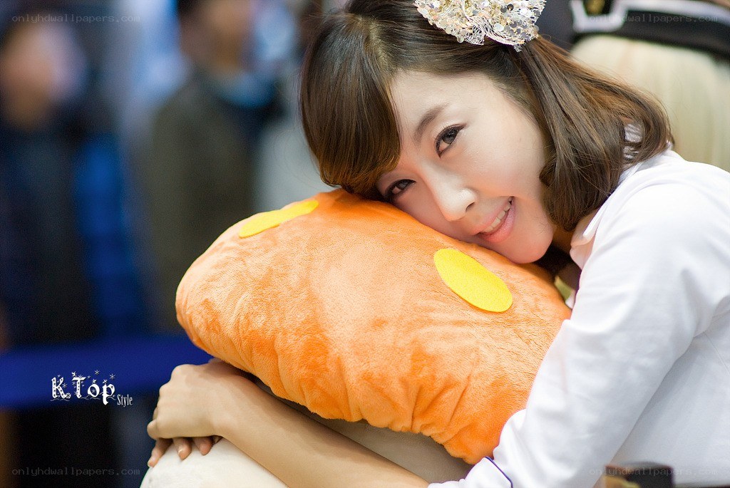 woman hugging plush pillow