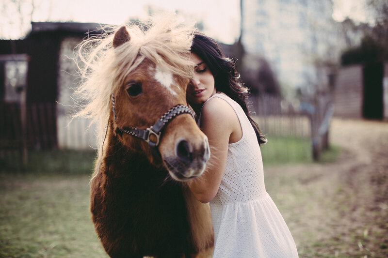 Woman Hugging Pony