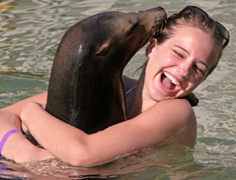 Woman Hugging Sea Lion