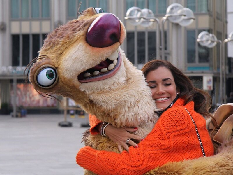 Woman Hugging Sloth