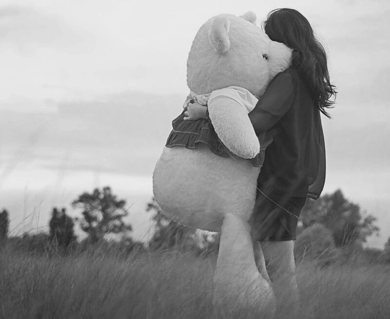 Woman Hugging Teddy Bear — Black