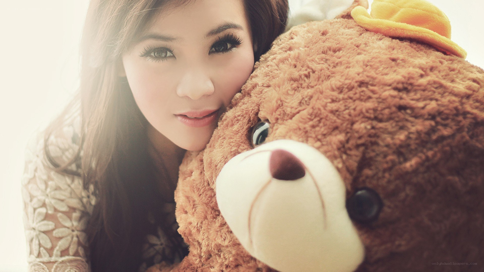 woman hugging teddy bear