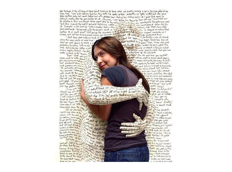 woman hugging text wall