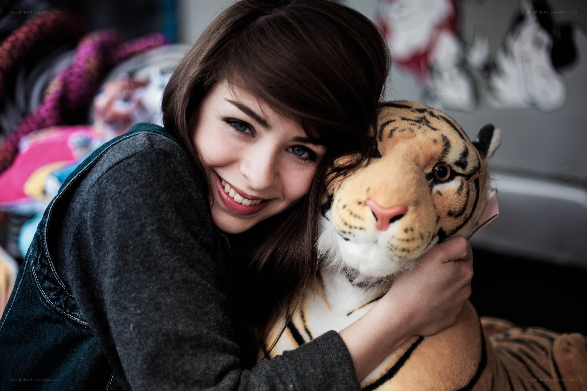 woman hugging tiger plush