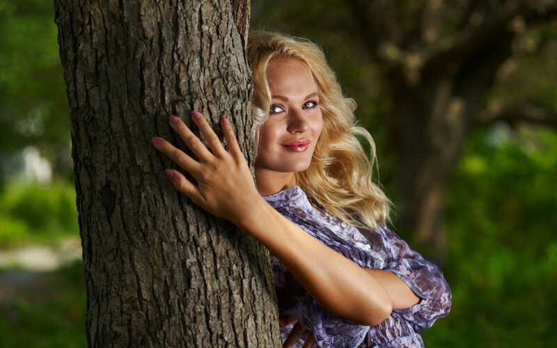 Woman Hugging Tree — Green, Serene, Afternoon