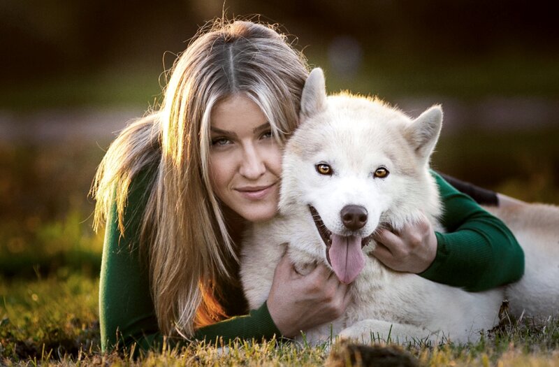 Woman Hugging White Dog — Green