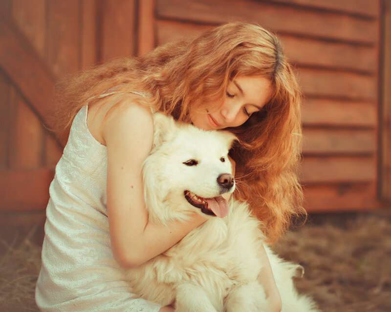 Woman Hugging White Dog — Peaceful