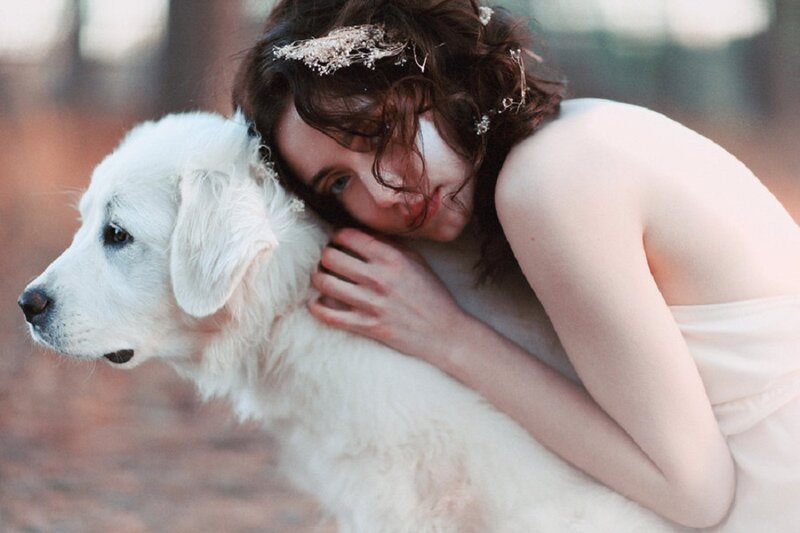 Woman Hugging White Dog