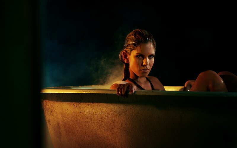 woman in a bathtub at night