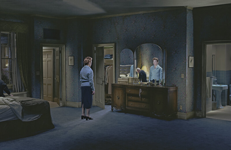 Woman in a bedroom at night