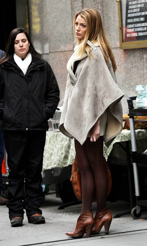Woman in a beige coat on the street