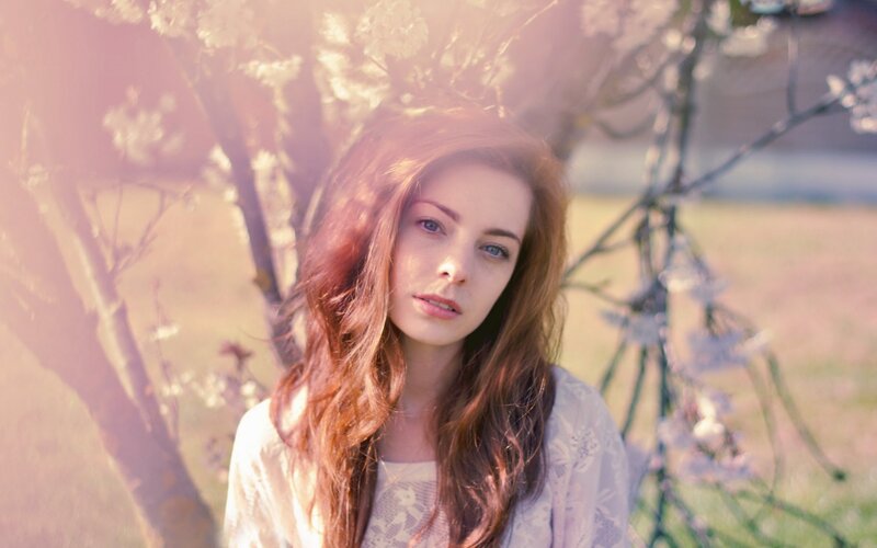 woman in a blossoming garden