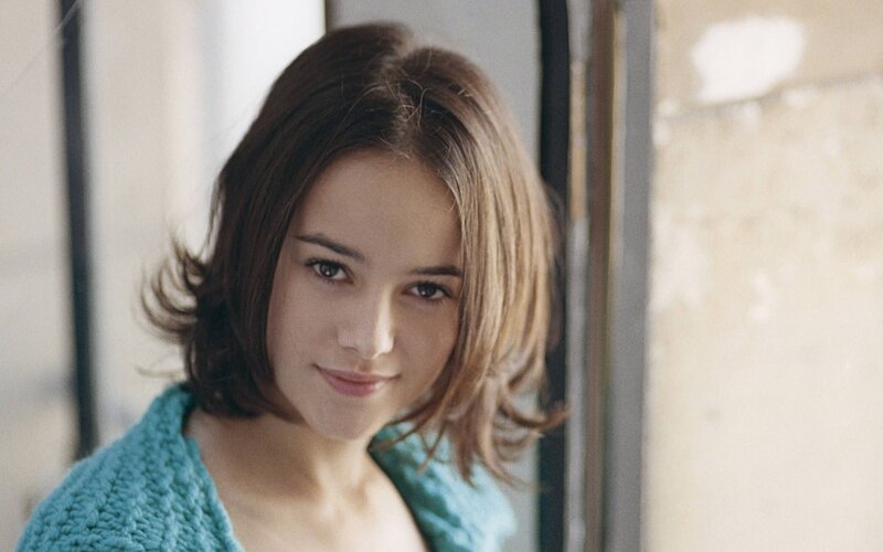 woman in a blue sweater