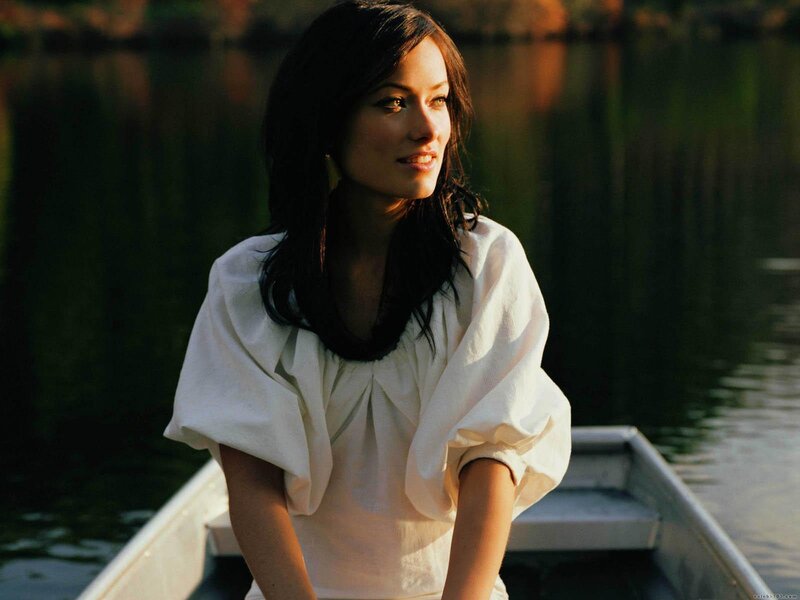 woman in a boat at sunset