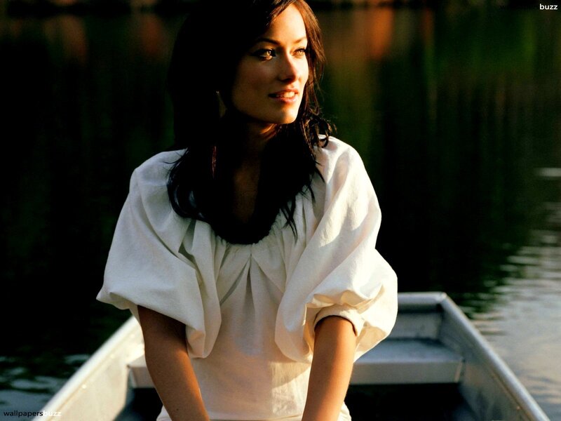 woman in a boat at sunset