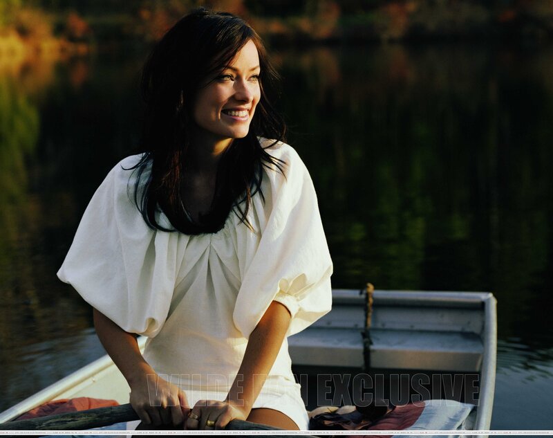 woman in a boat at sunset