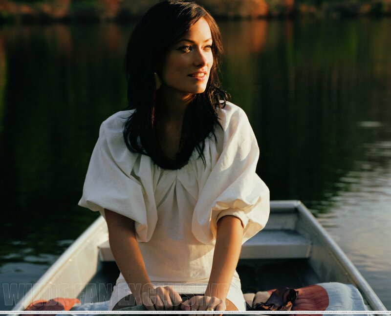 woman in a boat at sunset