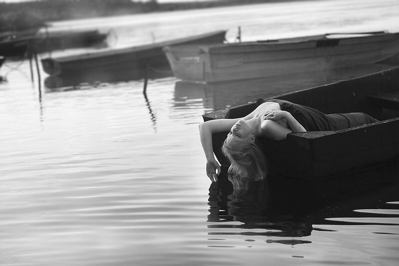 Woman in a Boat — Black, Serene