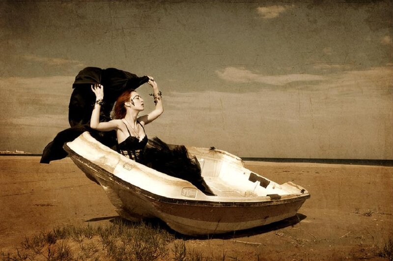 Woman in a Boat — Brown, Dramatic