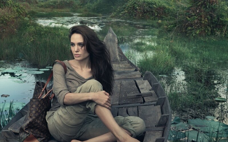 woman in a boat on a river