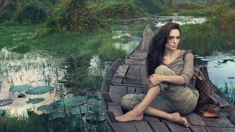 Woman in a boat on a swamp