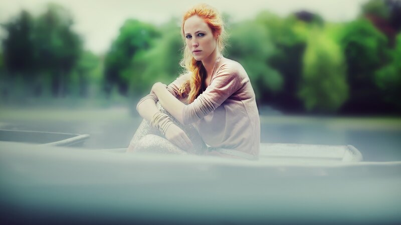 woman in a boat on water
