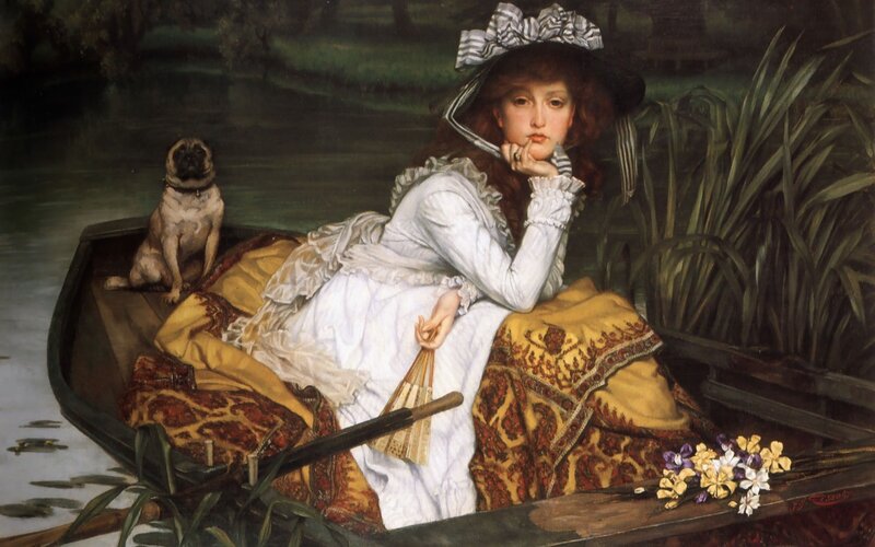 Woman in a boat with a dog