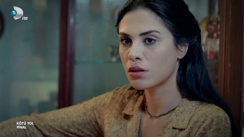 woman in a brown blouse