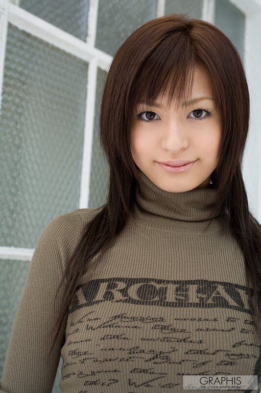 woman in a brown turtleneck