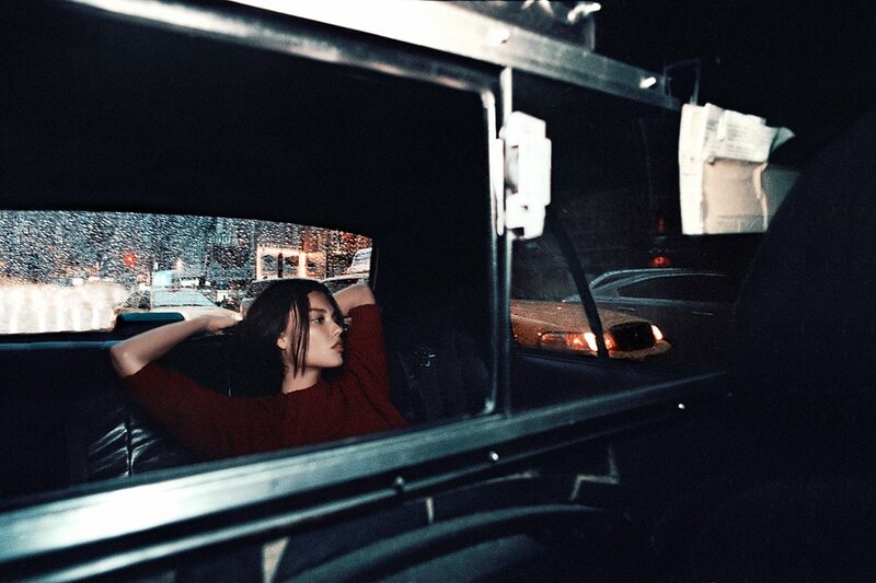 woman in a car at night