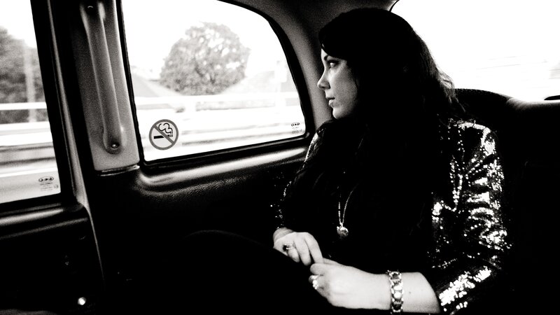 Woman in a Car — Black, Contemplative
