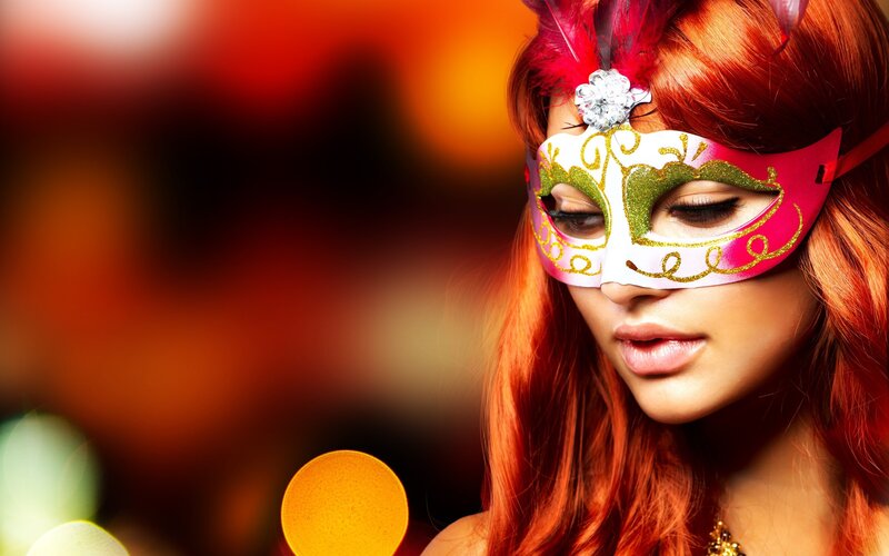 woman in a carnival mask