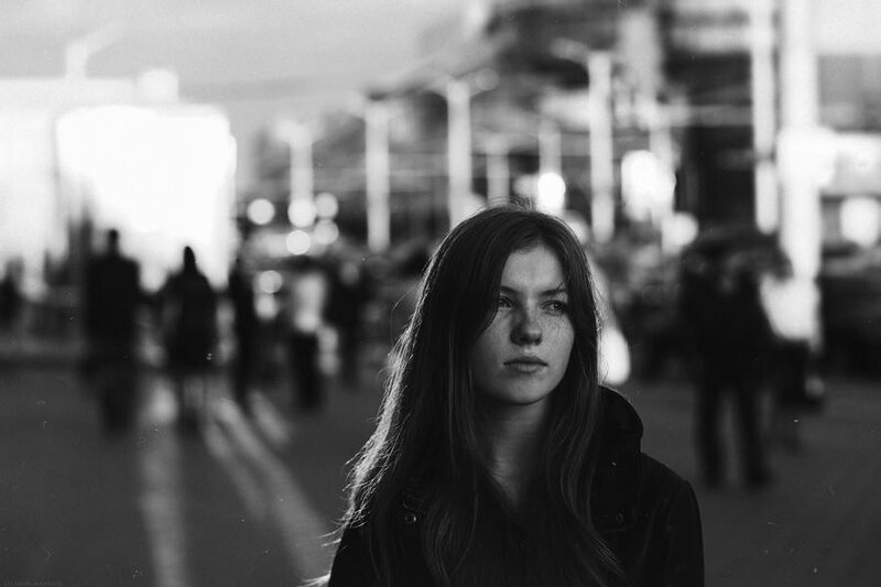 woman in a city at night