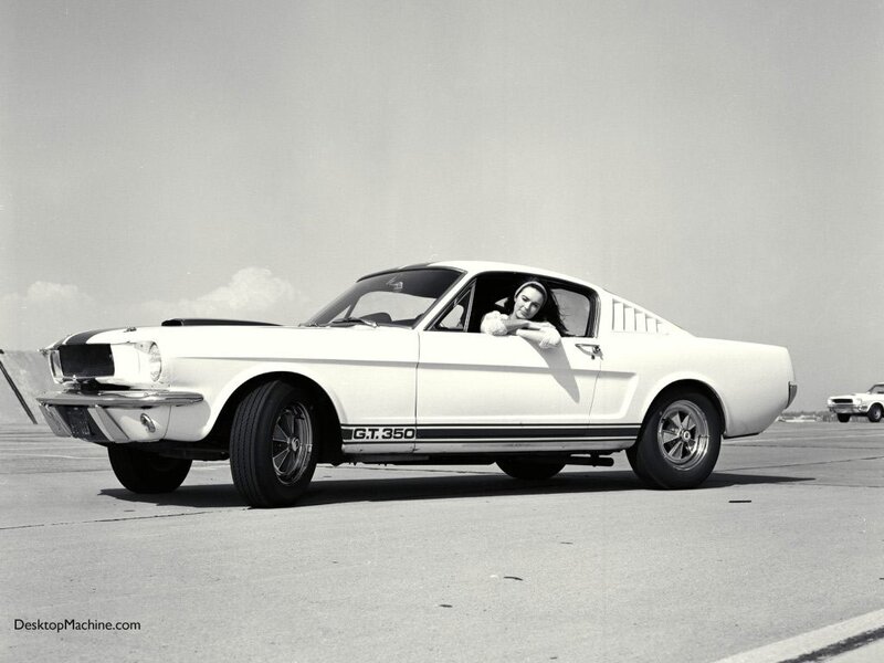 Woman in a classic Mustang
