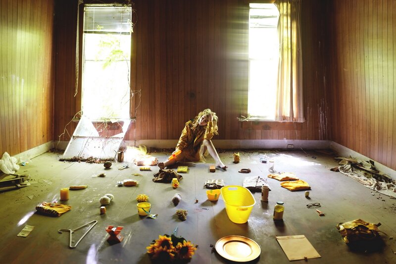 Woman in a cluttered room